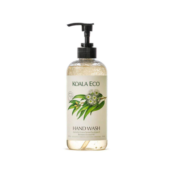 Hand wash in a clear pump bottle with pale golden liquid, black dispenser, and green eucalyptus leaves with white flowers; Hand Wash - Lemon-Scented Eucalyptus