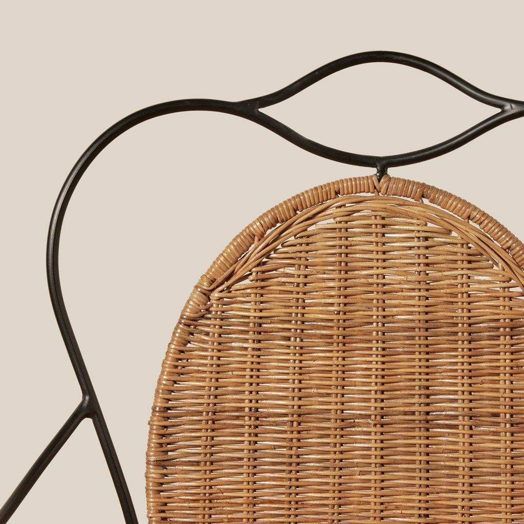 Lacoste Indoor/Outdoor Wicker Arm Chair featuring natural rattan woven seat and black wrought iron frame with vintage-inspired design