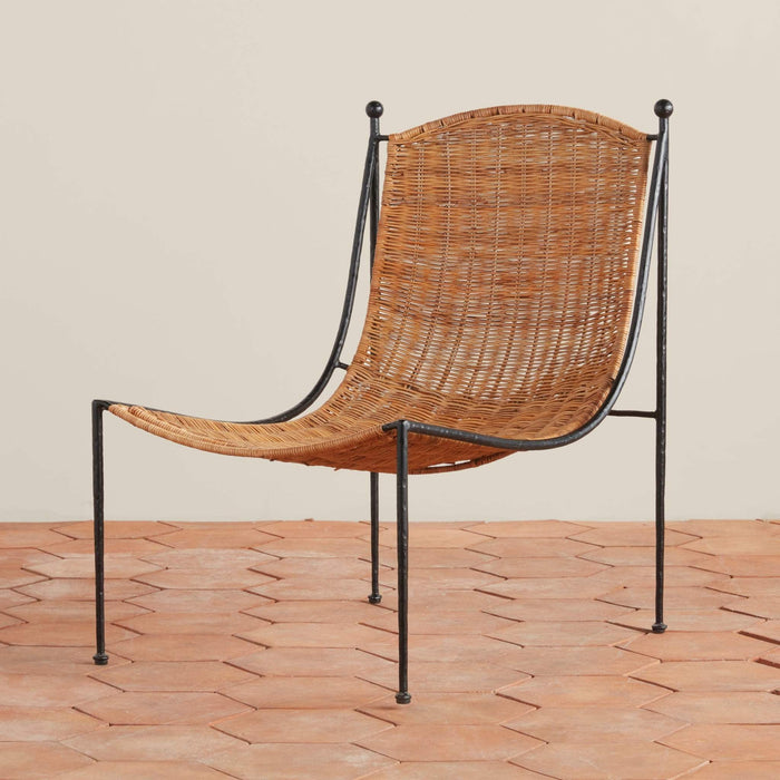 Lacoste indoor outdoor wicker lounge chair with rattan and wrought iron