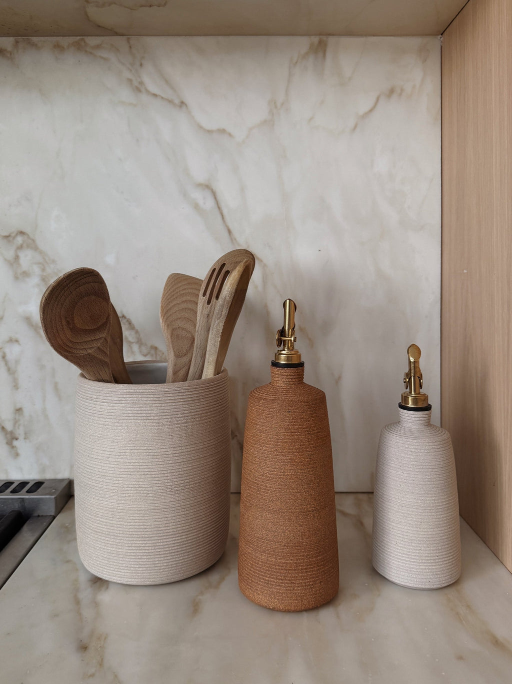 Ivory Lucca Ceramic Vinegar Bottle with ribbed texture and antique brass pour spout