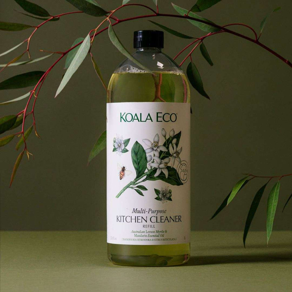 Multi-Purpose Kitchen Cleaner refill in a clear bottle with pale green liquid, botanical label, and black cap