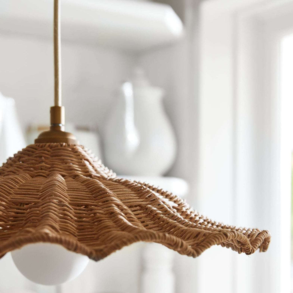 Savannah Pendant with natural brown woven wicker shade, scalloped edges, and a visible white bulb beneath