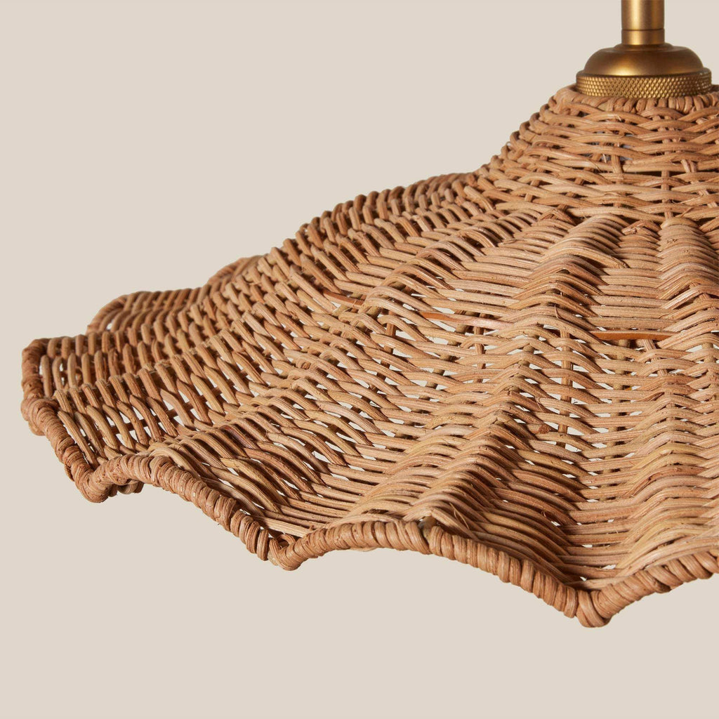 Savannah Pendant with natural wicker weaving in a warm brown tone, featuring a scalloped shade and brass canopy
