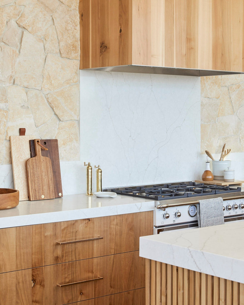 Atlas Brass Grinders styled in a warm and modern kitchen.