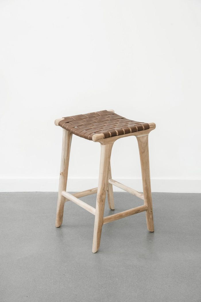 Comfortable, casual, leather-strapped counter height Backless Woven Leather Counter dining stool in Saddle. Handmade in Bali using Teak wood and vegetable-tanned leather imported from Java. - Saffron and Poe