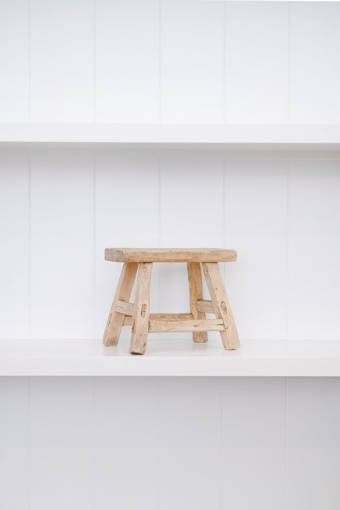 Petite rectangle stool on white shelf with white background. - Saffron and Poe