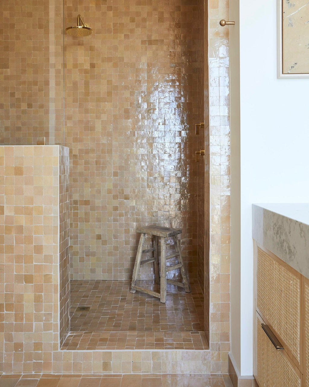 Vintage antique stool made of solid elmwood inside a tiled shower space