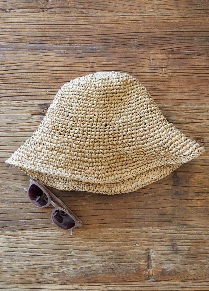 Side View of Bali Bucket Hat on vintage coffee table