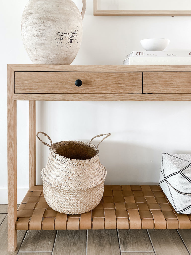 Close up view of White Oak Leather Strap Console with hand-beaded Bali basket. - Saffron and Poe