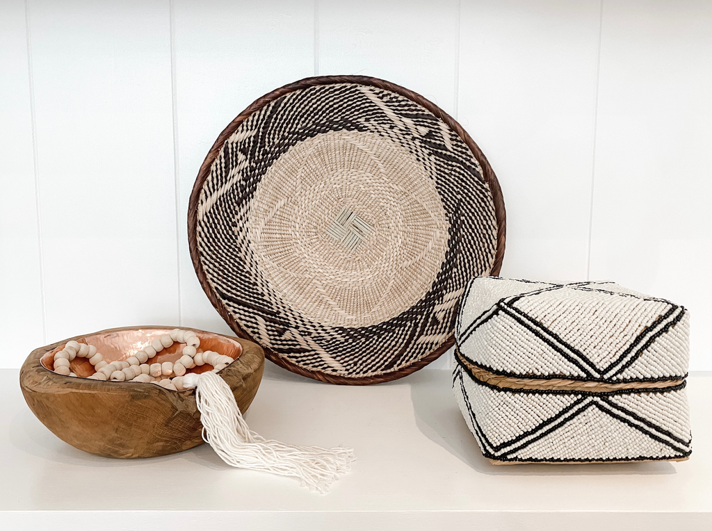 Saffron + Poe Curated Shelf Bundle with hammered copper bowl, tasseled Bali beads, Ilala palm wall basket, and hand beaded Bali basket box
