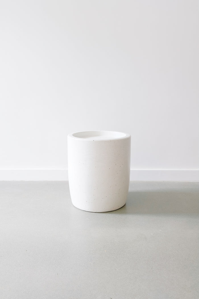 Front view of an Abalone Terrazzo Side Table against a white wall. - Saffron and Poe