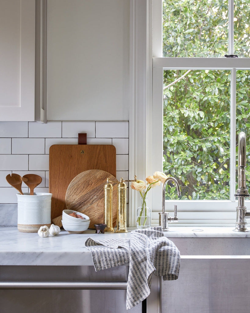 Atlas Brass Pepper Grinder styled in a modern and clean kitchen 