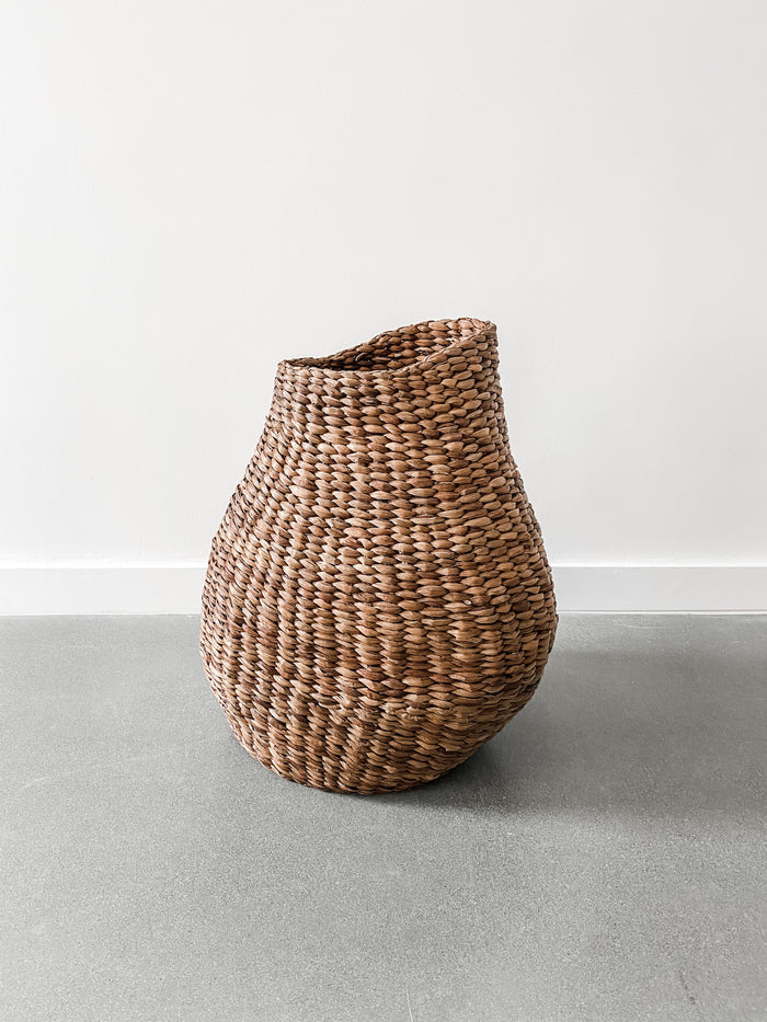 One Sculptural Nest Basket in front of a white background - Saffron and Poe