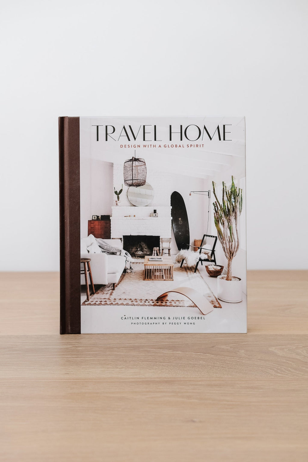 Travel Home book cover featuring a stylish global-inspired interior design with neutral tones and natural elements