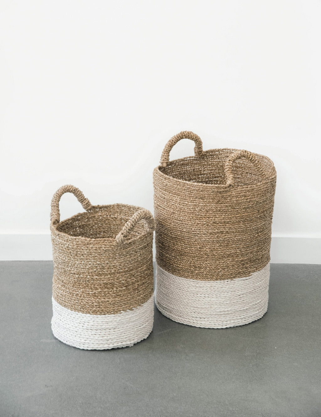 Two-toned structured hyacinth storage baskets with handles, handcrafted from natural water hyacinth, ideal for versatile home storage.
