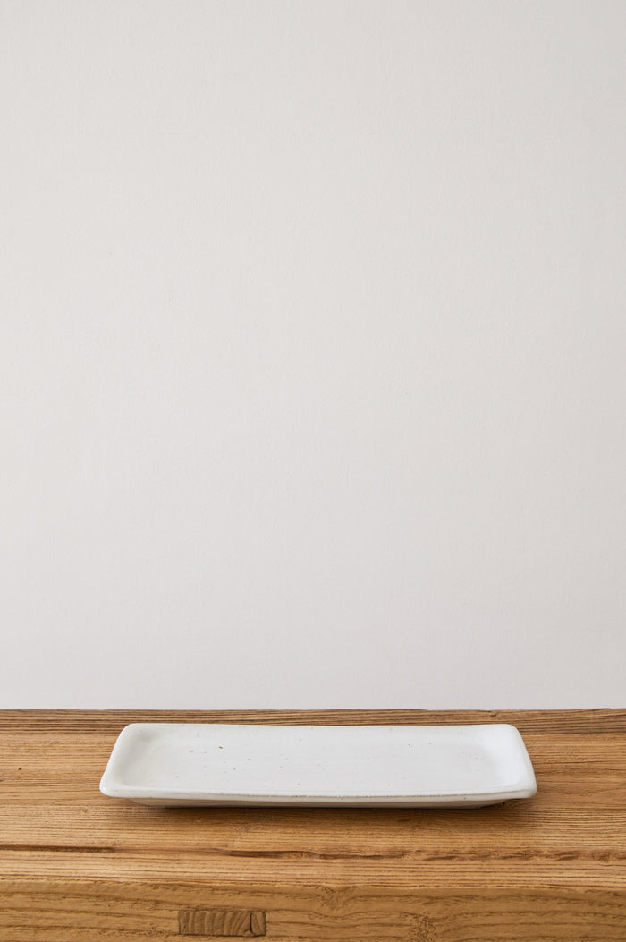 Front view of Hanselmann Hand Thrown Ceramic Tray on a vintage console with a white background. - Saffron and Poe