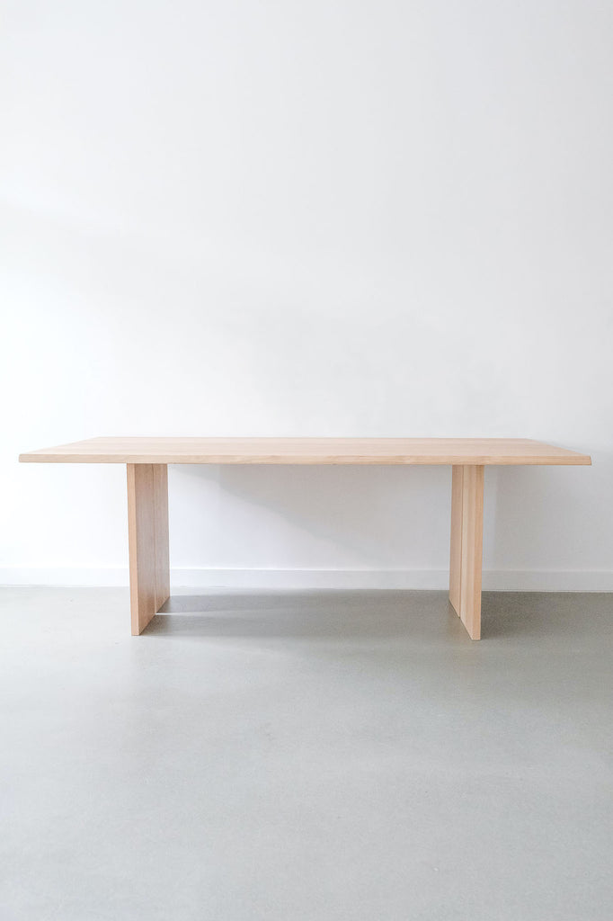 Front view of White Oak Live-Edge Table against a white wall. - Saffron and Poe