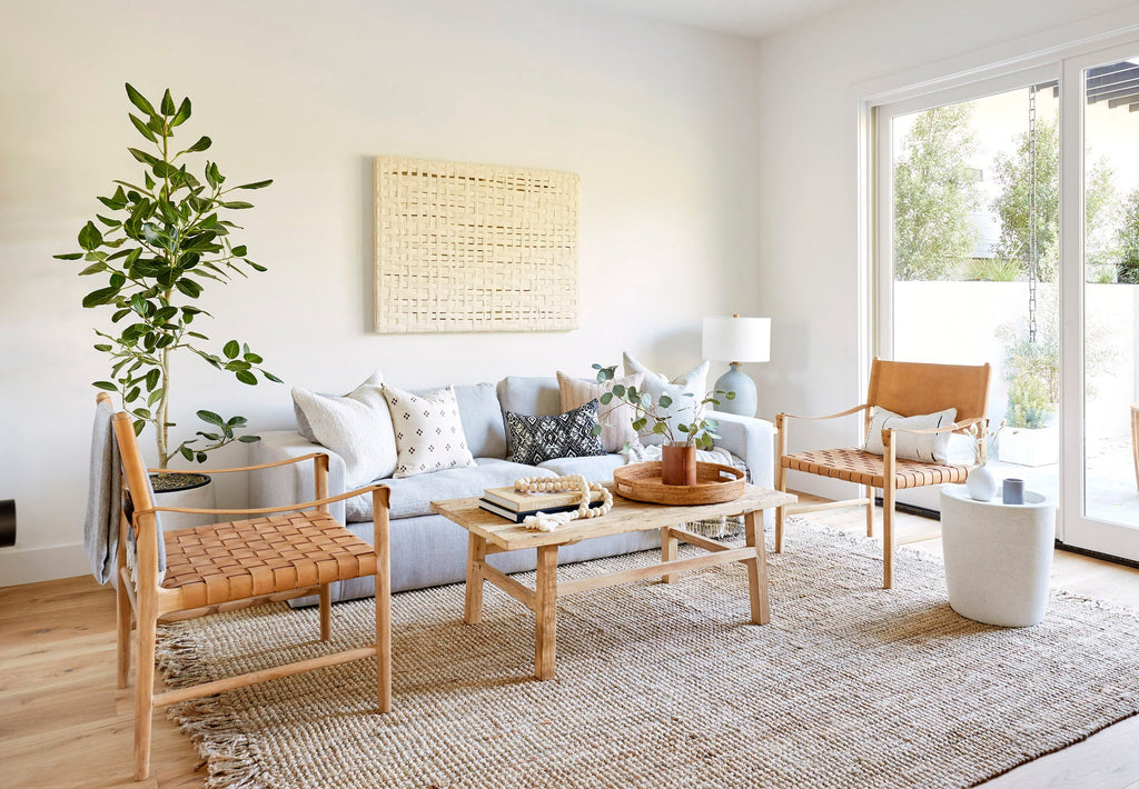 Abalone terrazzo side table in modern living room with wooden chairs and sofa
