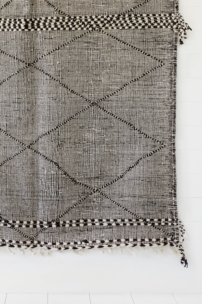 Close up view of No. 27 - Moroccan Flat Weave Kilim Rug against a white background. - Saffron and Poe