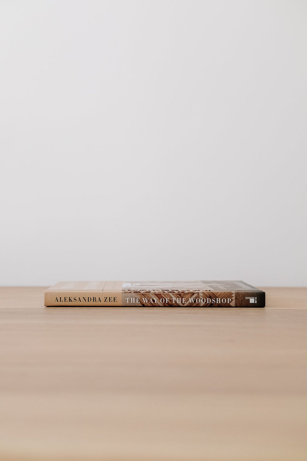 The Way of the Woodshop woodshop guidebook by Aleksandra Zee on wooden table