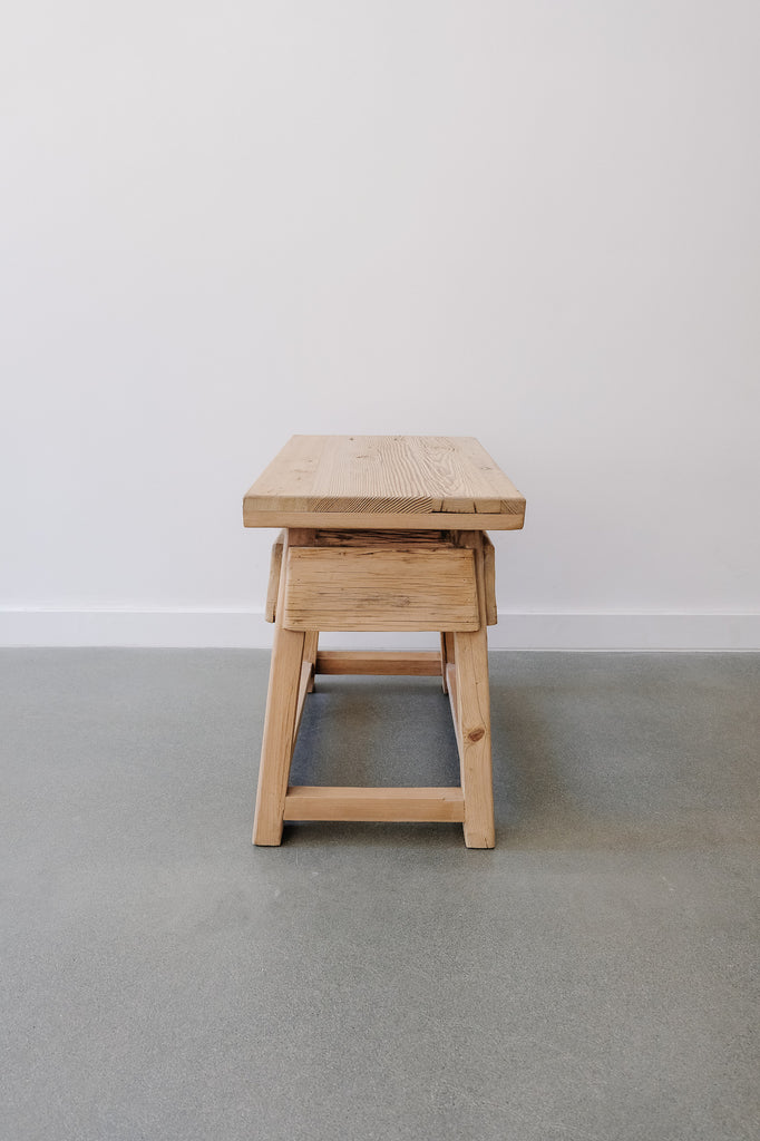 Side view of Vintage Cedar End Table against a white wall. - Saffron + Poe