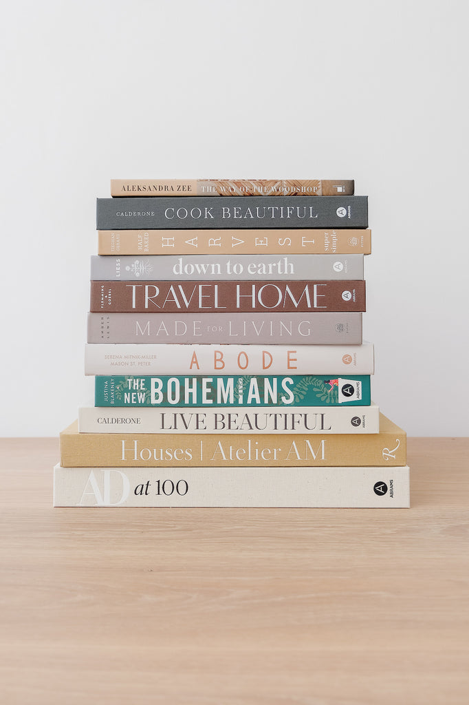 Cook Beautiful with stacked book collection