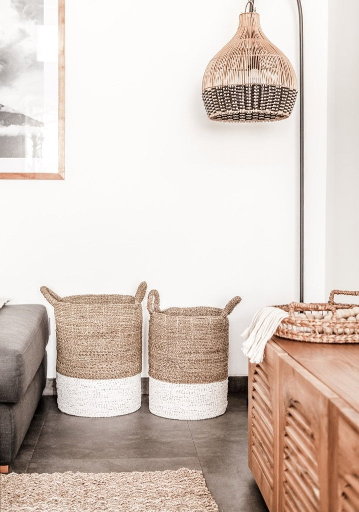 Set of cream-colored with white base Structured Hyacinth storage baskets with handles styled in livingroom. Handmade in Bali using natural water hyacinth  - Saffron and Poe
