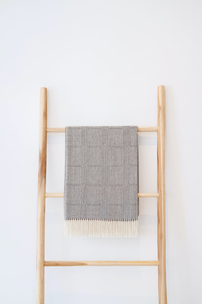 Styled Alpaca Throw Blanket on a teak wood blanket ladder. - Saffron and Poe