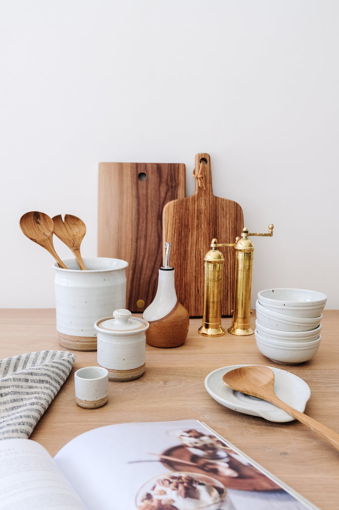 Styled Hand Thrown Ceramic Sugar Jar with the Hanselmann Pottery Collection, Studio Inko Cutting Boards, Uzumati Ceramic Olive Oil Bottle and Atlas Brass Grinders. - Saffron and Poe