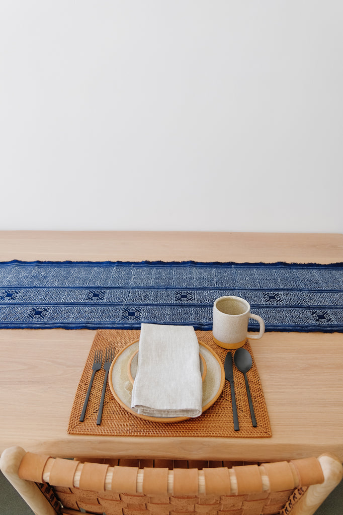 Styled Hmong Batik Table Runner on an Oak Dining Table with Uzumati Ceramics and a Tenganan Placemat. - Saffron and poe