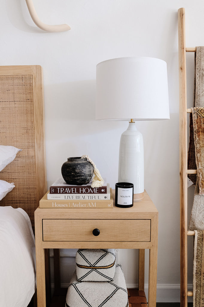 Styled La Botica Nolita Candle on an Oak and Leather Strap Side Table. - Saffron and Poe