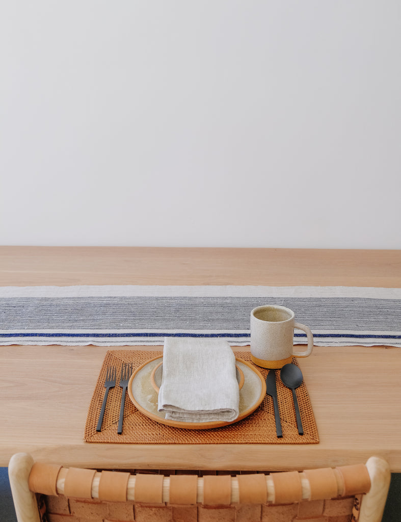 Styled Vintage Table Runner on an Oak Dining Table with a Tenganan placemat, and Uzumati Ceramics. - Saffron and Poe