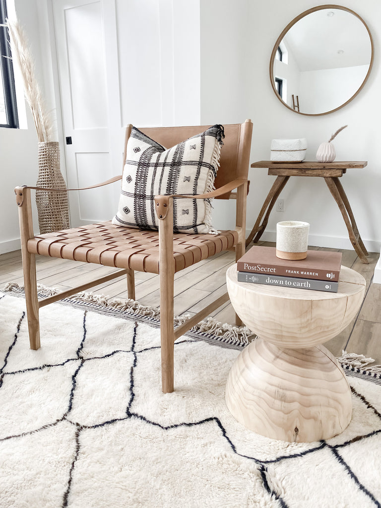 Styled angled view of Leather Strap Safari Lounge - Beige - on a Beni Ourain Rug - Handcrafted in Bali. Teak wood and leather straps. - Saffron and Poe