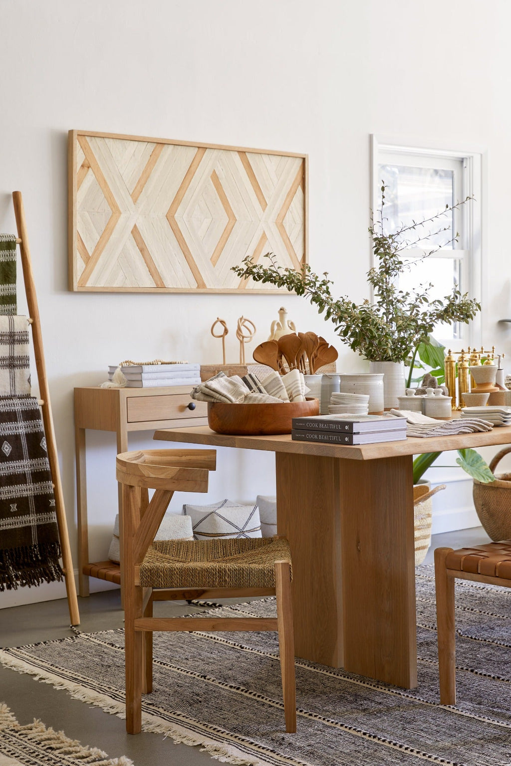 Woven Wishbone Dining Chair with braided rattan seat and teak frame in a modern dining room setting