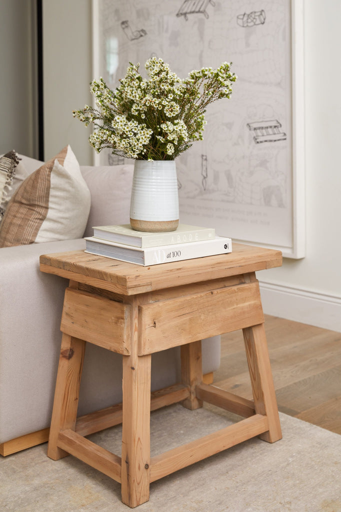 Vintage Cedar End Table styled in a living room setting with Hand Thrown Ceramic Vase and coffee table books. - Saffron + Poe