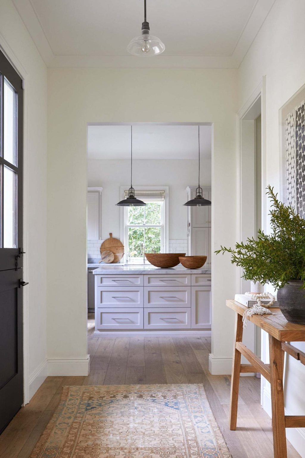 Woven Tenganan basket on kitchen counter with minimalist decor and natural light