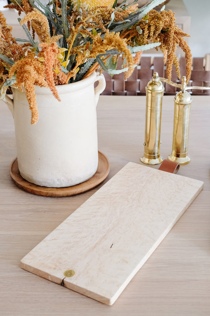 Styled Studio Inko Bird's EyeMaple Cutting and Serving Board on a white oak dining table. - Saffron and Poe