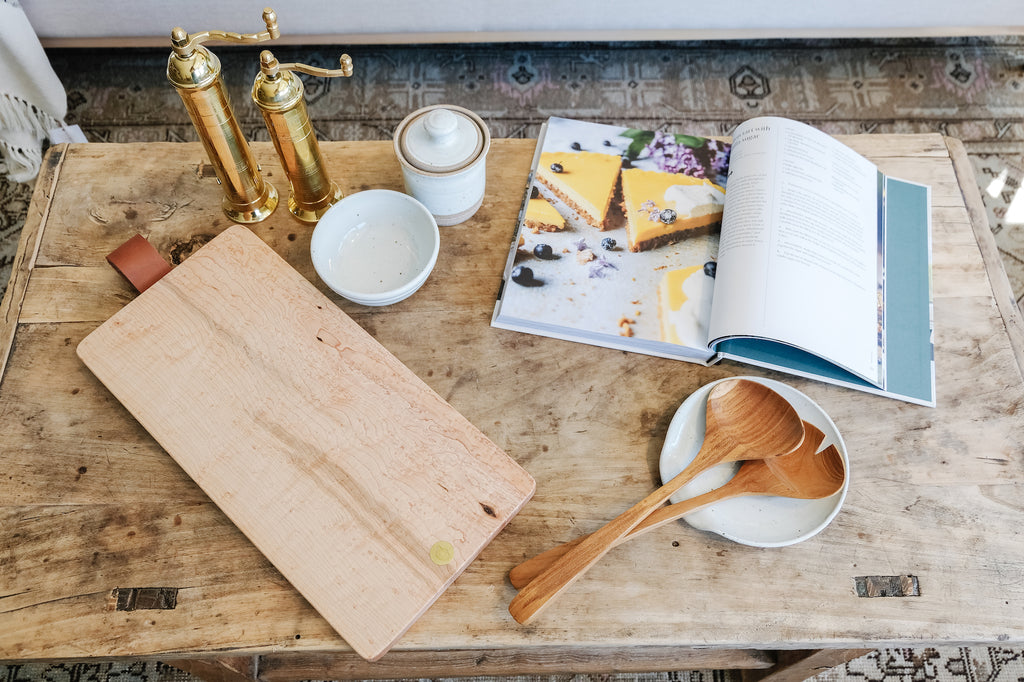 Styled Studio Inko Bird's Eye Maple Serving Board with Handselmann Ceramics and Wooden Tongs. - Saffron and Poe