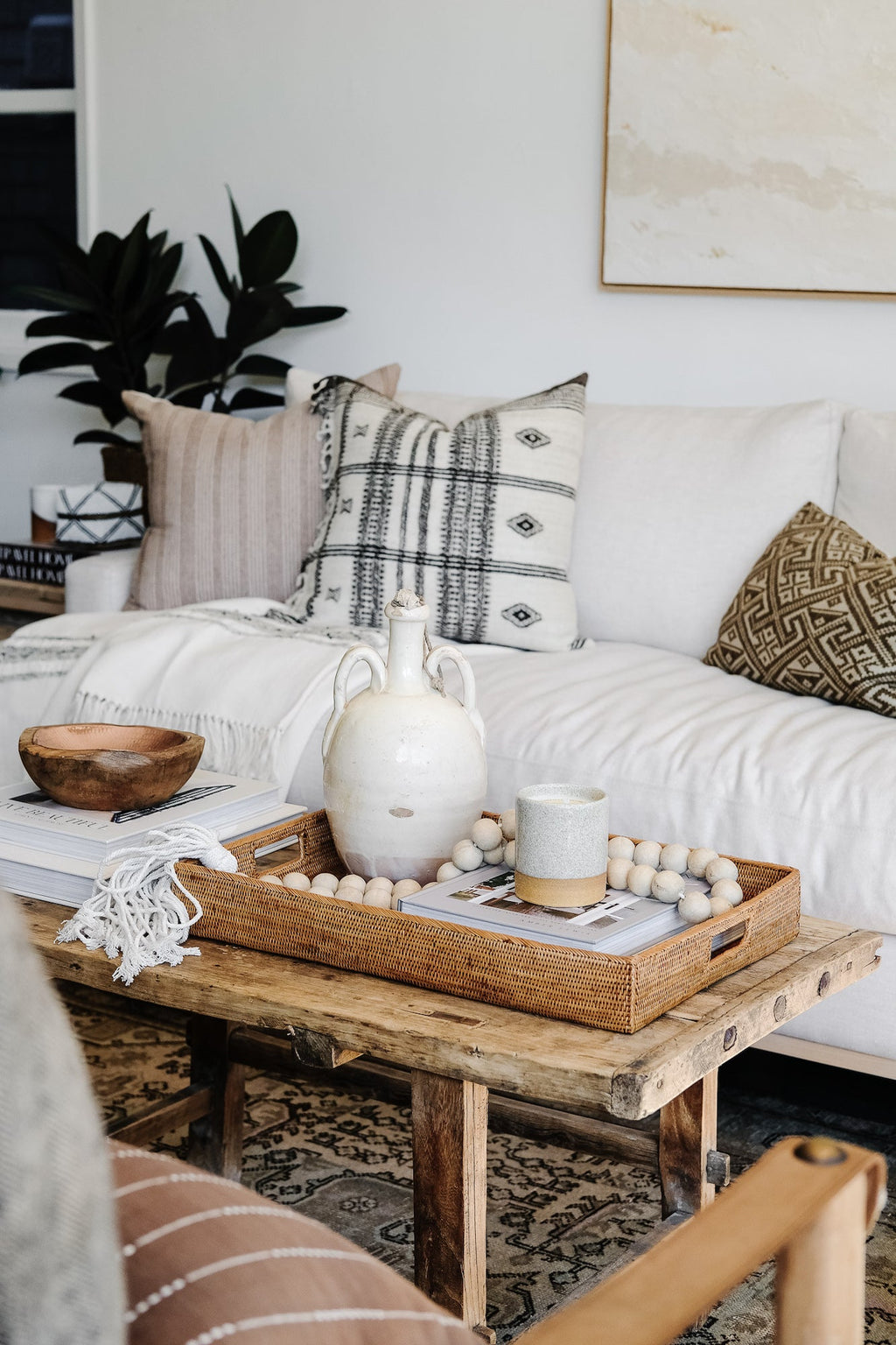 Tenganan Basket Tray made from natural Ata reed on rustic wooden table in cozy living room setting