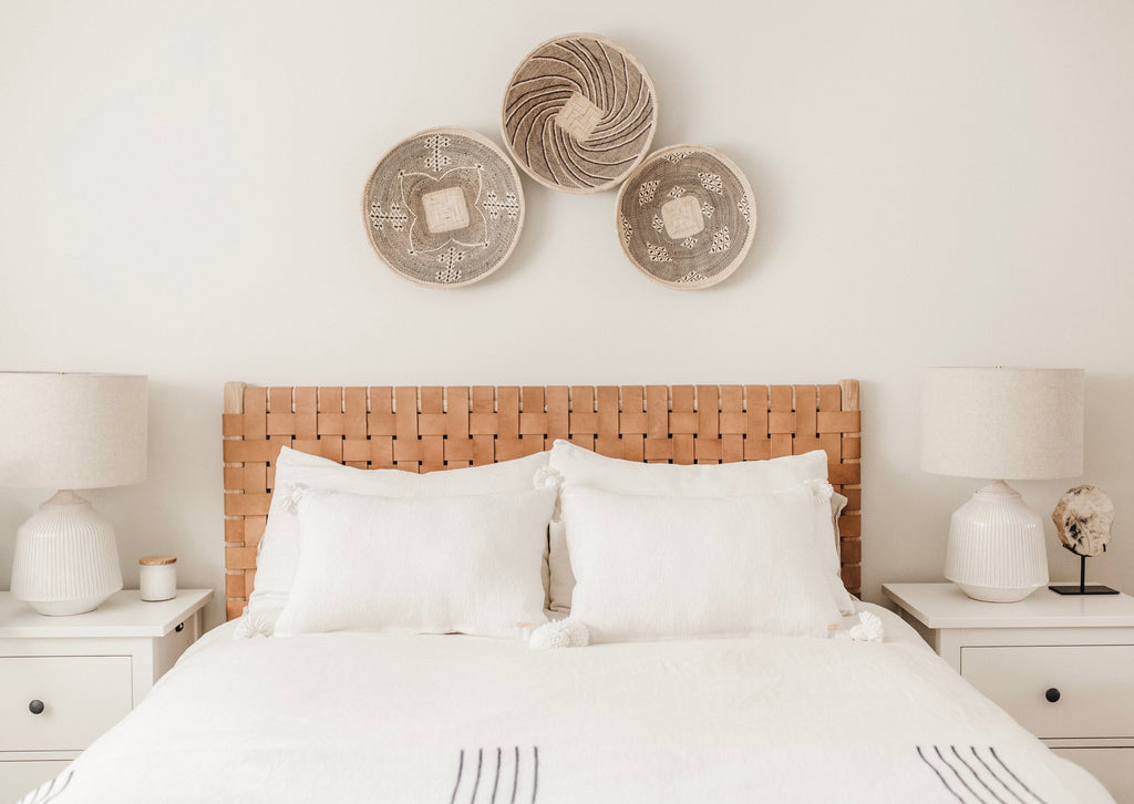 Woven Leather Strap Headboard in beige styled in bedroom. Handcrafted in Bali with teak and leather. - Saffron and Poe