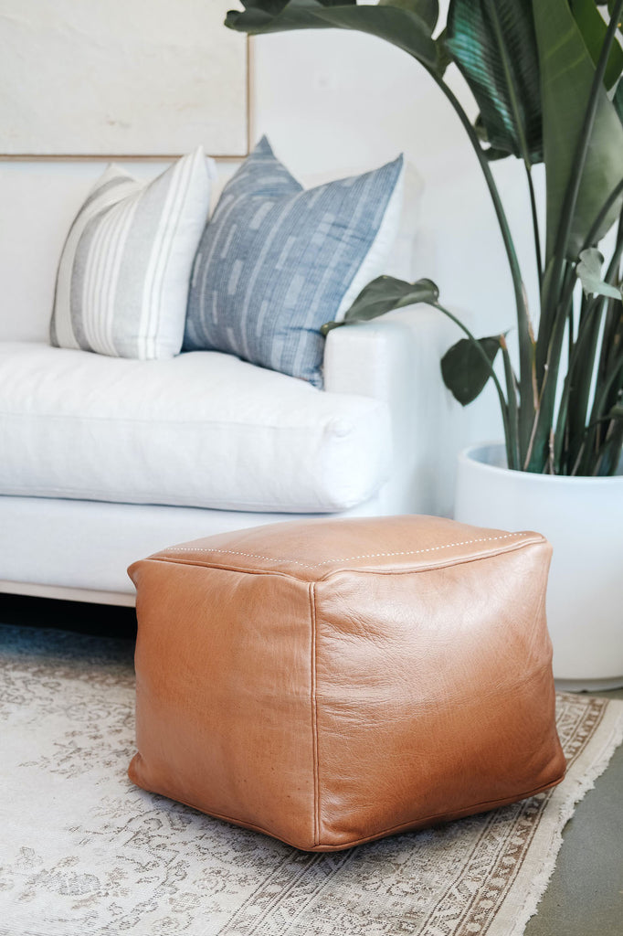 Styled view of Square Leather Moroccan Pouf in a living room with Hmong Hemp Pillows. - Saffron and Poe