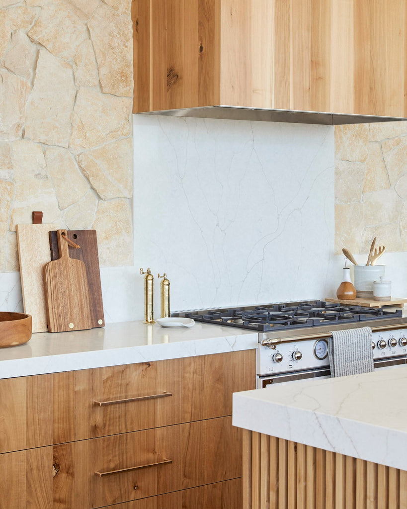 Atlas Brass Grinders styled in a warm and modern kitchen.