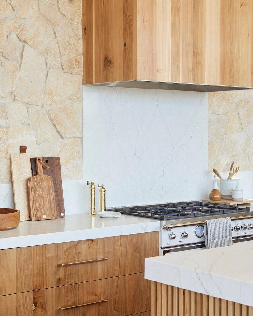 Atlas Brass Grinders styled in a warm and modern kitchen.